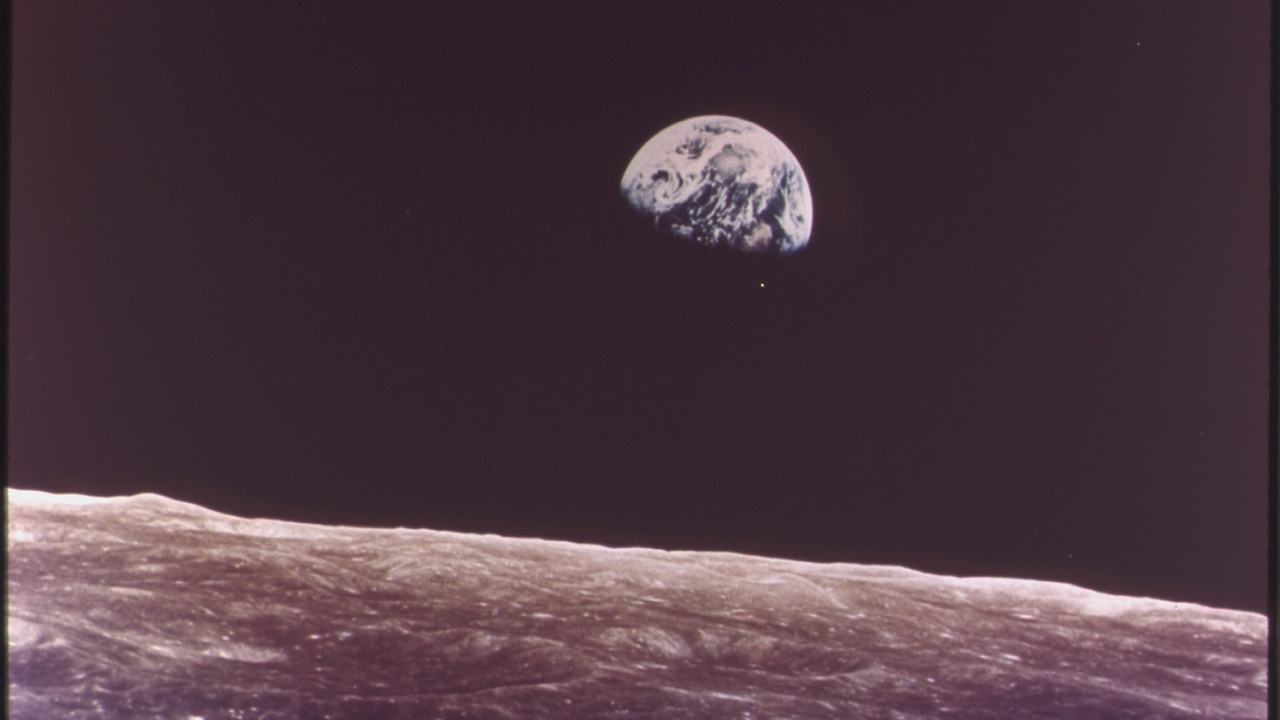 Iconic human spaceflight photographs including Earthrise and Apollo 11 lunar surface photos