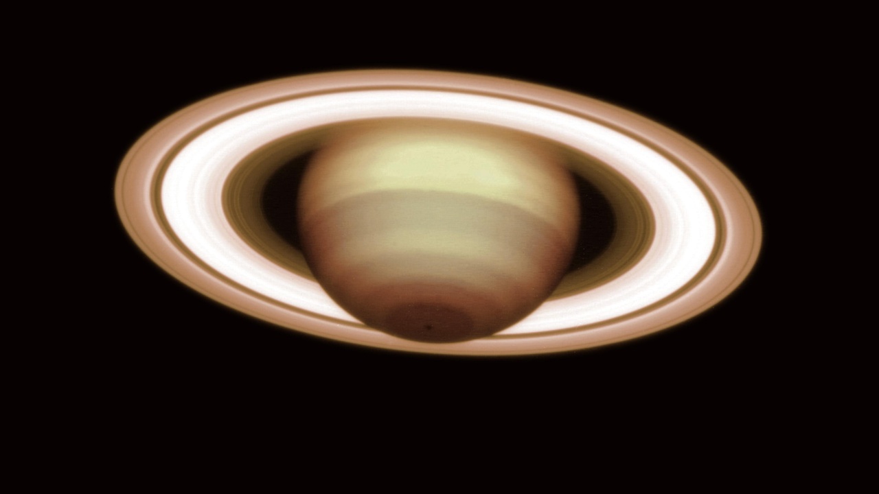 Saturn rings and Pluto bright terrains showing reflective ice and surfaces