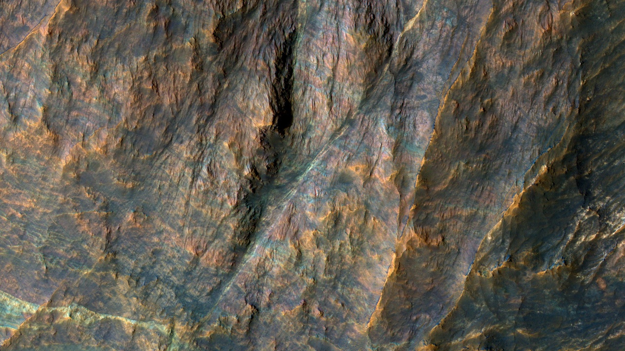 Aerial view of Olympus Mons and Martian terrain showing layered rock and dust