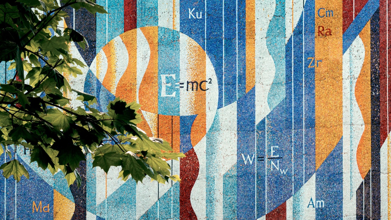 Illustration of spacetime curvature and clock showing time dilation