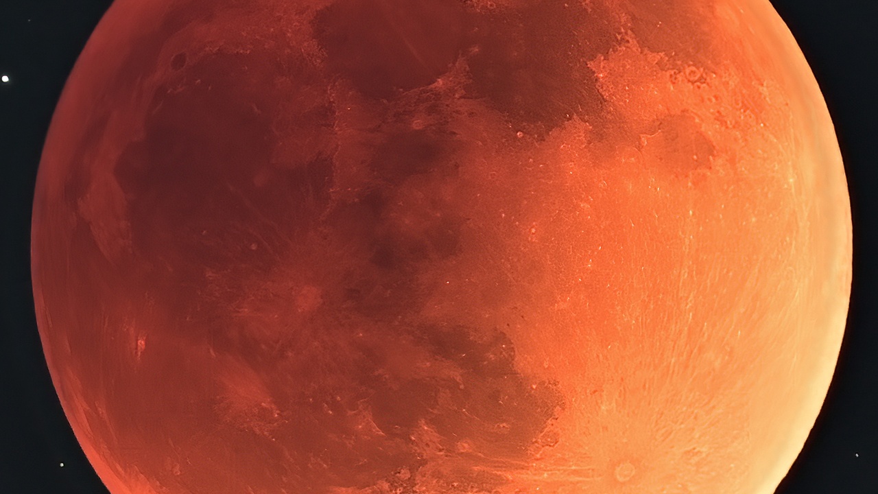 Total lunar eclipse showing Earth's shadow and red coloration