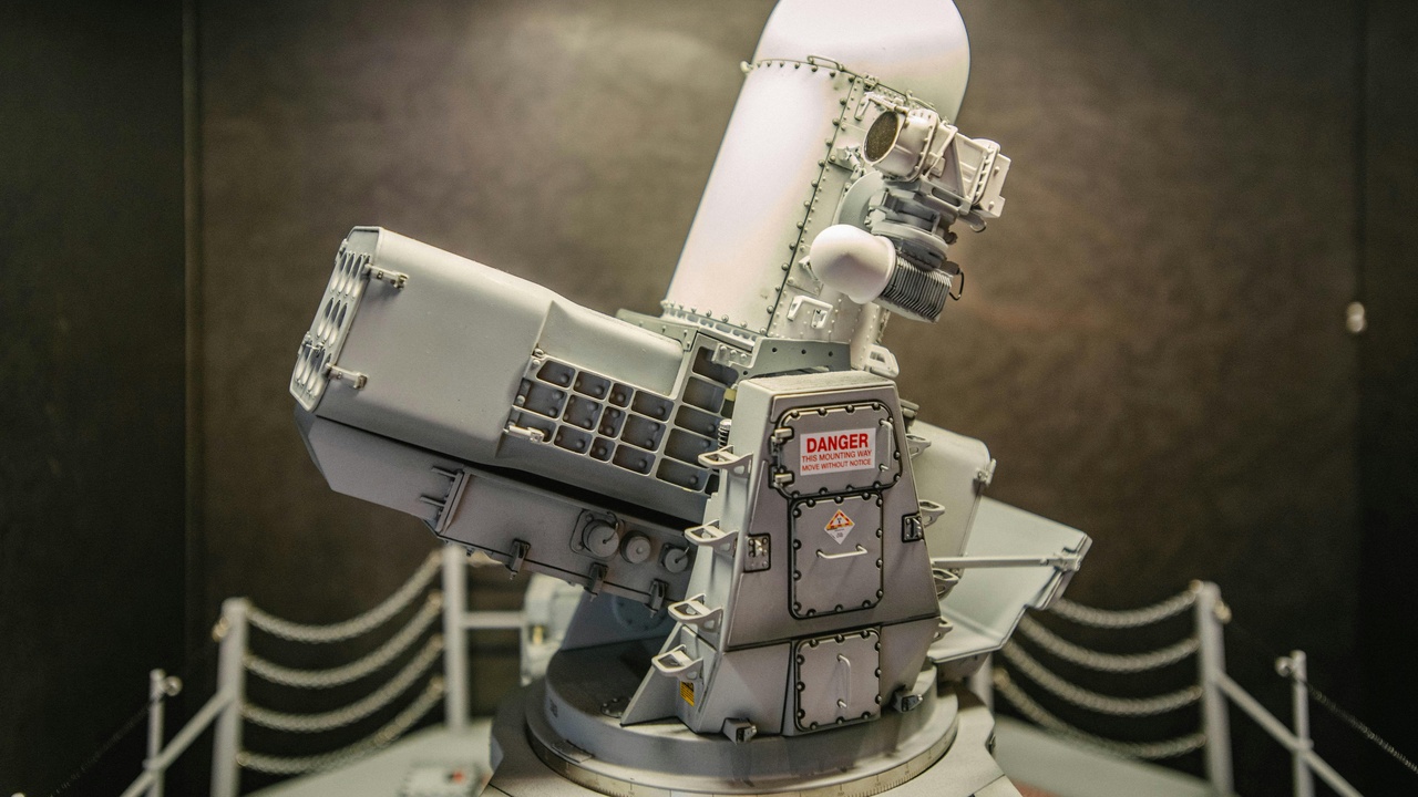 Engineers working on telescope instruments and detectors in a cleanroom