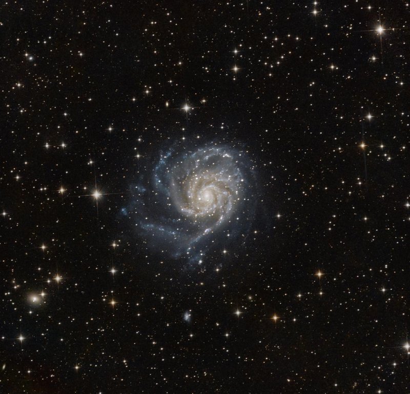 Mesmerizing image of the Pinwheel Galaxy, Messier 101, surrounded by stars in deep space.