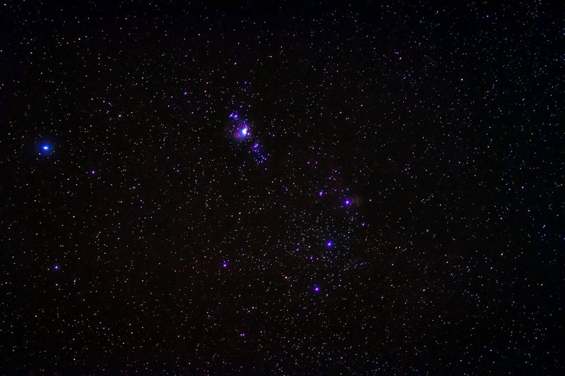 A breathtaking view of the Orion constellation amidst a star-filled night sky.