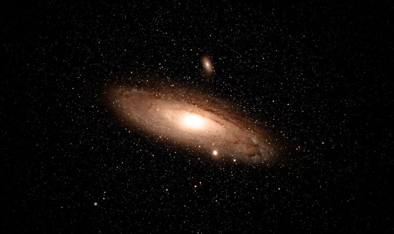A breathtaking image of the Andromeda Galaxy surrounded by countless stars in deep space.
