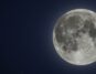 a full supermoon on a night sky